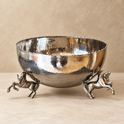 Luxury silver hammered decorative metal bowl with sculptural horse legs, handcrafted statement centerpiece for dining tables and home décor.