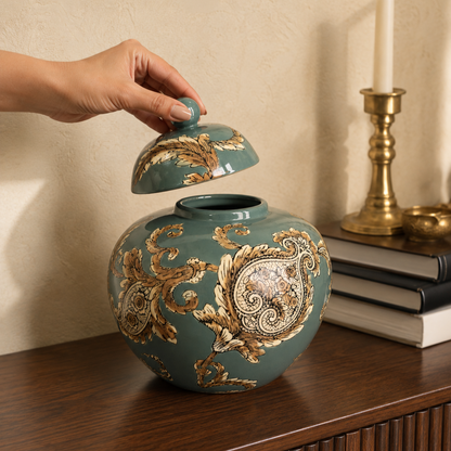 Hand lifting the lid of the Imperial Sage ceramic decorative ginger jar, showcasing its decorative storage functionality and handcrafted ceramic design.