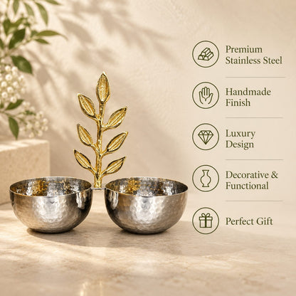 Inara handmade hammered stainless steel twin bowl set connected by a decorative brass gold leaf handle, displaying key product features including luxury handmade finish and premium design.