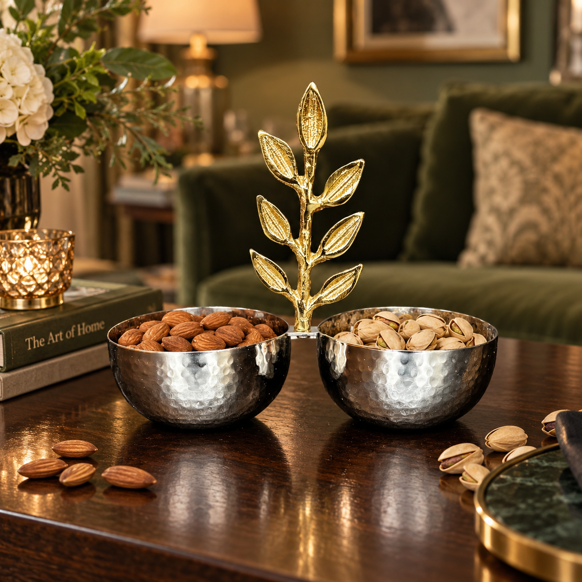 Inara handcrafted dual-bowl serving set filled with almonds and pistachios, styled on a dark wooden coffee table in an elegant living room setting.