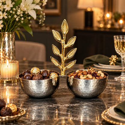 Inara luxury silver hammered double bowl filled with gourmet chocolates and mixed nuts set on an elegant marble dining table with candlelight and wine glasses.