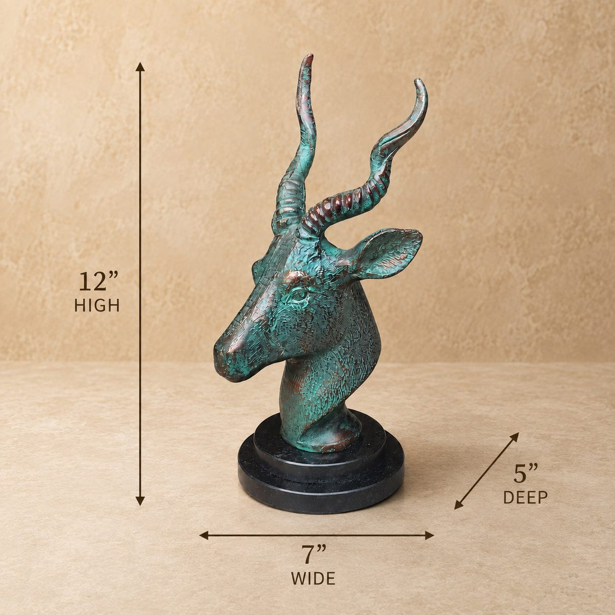 Dimension guide for antique bronze deer head sculpture showing 12-inch height, 7-inch width, and 5-inch depth on a black marble base.