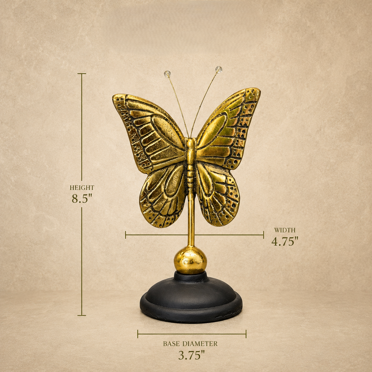 Dimensions guide of an antique brass butterfly figurine with an 8.5-inch height, 4.75-inch width, and 3.75-inch base diameter displayed on a luxury beige background by Inara Home Decor.