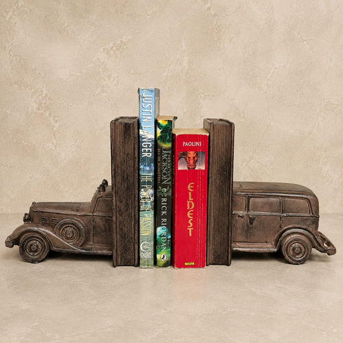 Vintage car bookends in an antique bronze finish holding books, handcrafted luxury decorative bookends for bookshelves, home office, study room, and living room décor.
