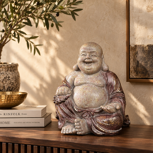 Handcrafted Laughing Buddha decorative statue styled on a wooden console in a luxury living room interior.