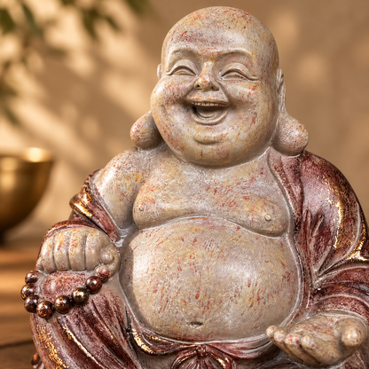 Close-up of handcrafted Laughing Buddha ceramic statue showcasing textured finish and smiling facial details.