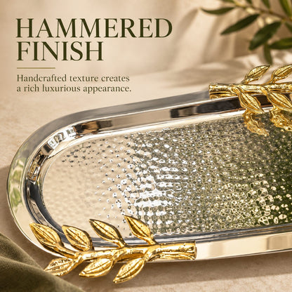 Close-up of the handcrafted hammered stainless steel surface and gold leaf handles of the luxury Leaf Handle Serving Tray.