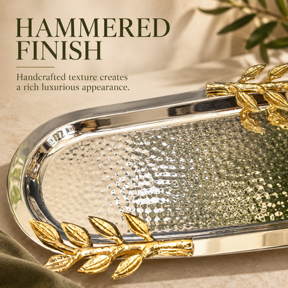Close-up of the handcrafted hammered stainless steel surface and gold leaf handles of the luxury Leaf Handle Serving Tray.