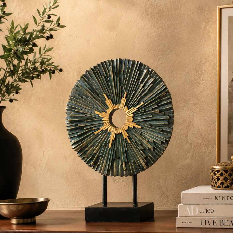 Luxury blue and gold modern decorative sculpture displayed on a walnut console table against a warm beige Venetian plaster wall, styled with olive branches, designer books, and elegant home décor in a premium contemporary interior.