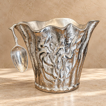 Luxury handcrafted aluminium ice bucket with matching scoop featuring an organic sculptural design for serving wine, champagne and ice.