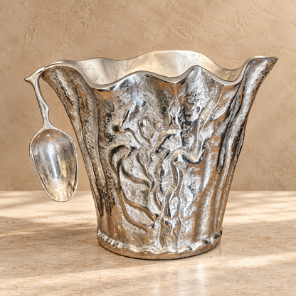 Luxury handcrafted aluminium ice bucket with matching scoop featuring an organic sculptural design for serving wine, champagne and ice.