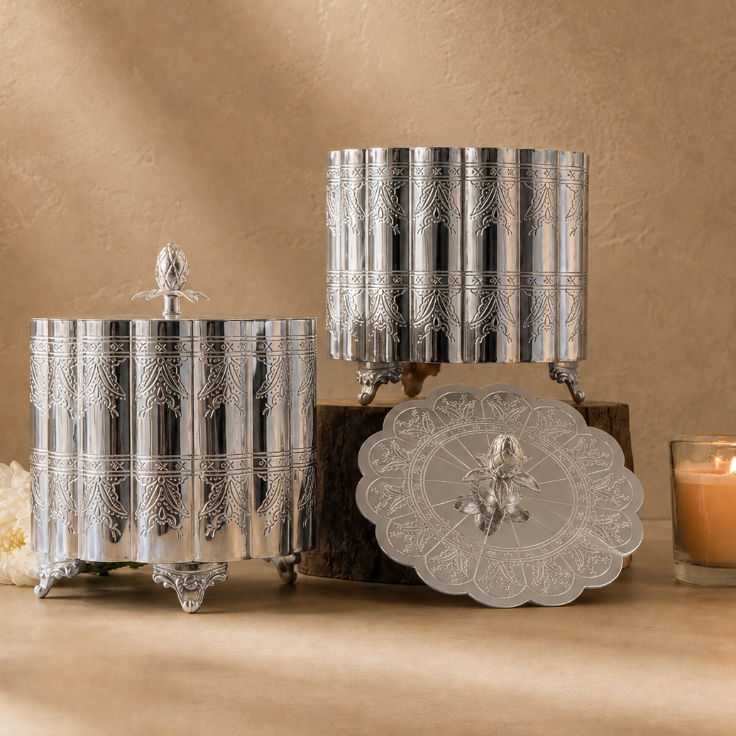 Luxury silver engraved storage container set with decorative lids, handcrafted premium metal storage jars for elegant home décor and tabletop styling by Inara Home Decor.