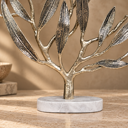 Premium metal olive tree sculpture featuring a solid white marble base with elegant handcrafted branches and textured leaves.