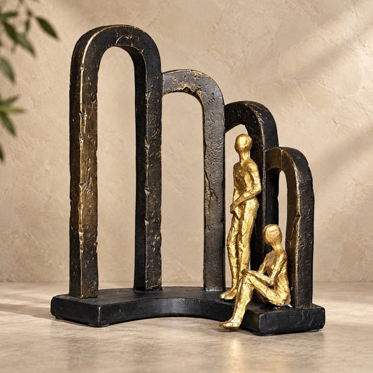 Modern Togetherness resin sculpture in black and gold finish with abstract arches, luxury tabletop home décor for living room, bedroom, and office.