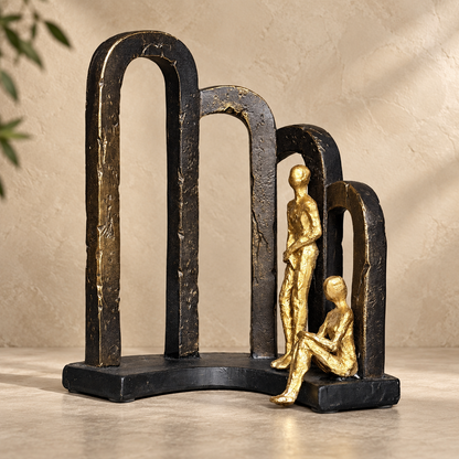 Modern Togetherness resin sculpture in black and gold finish with abstract arches, luxury tabletop home décor for living room, bedroom, and office.