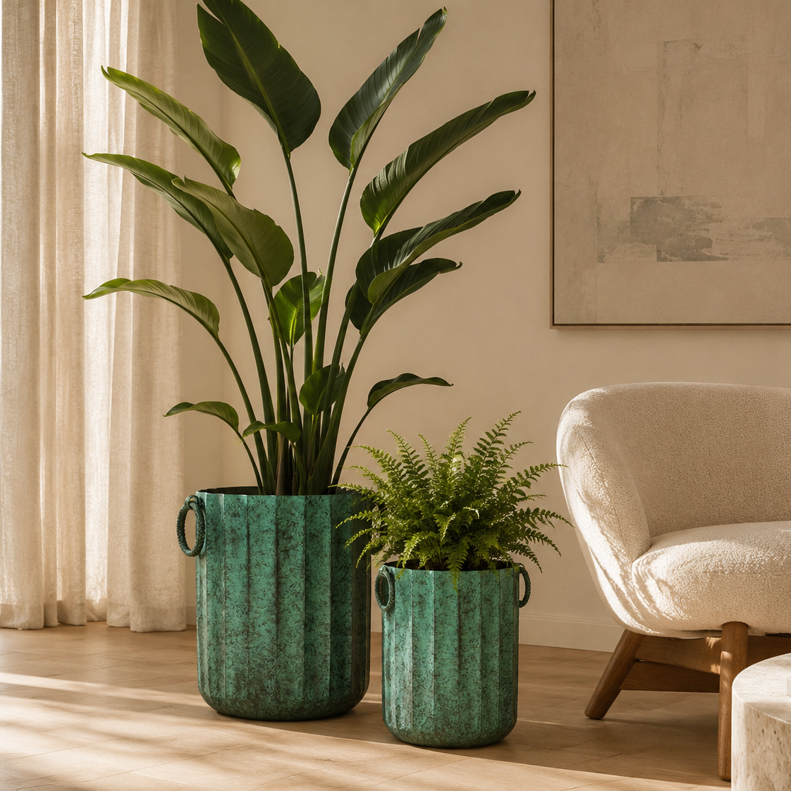 Large and small vintage green metal planters styled with indoor plants in a modern luxury living room with natural sunlight.