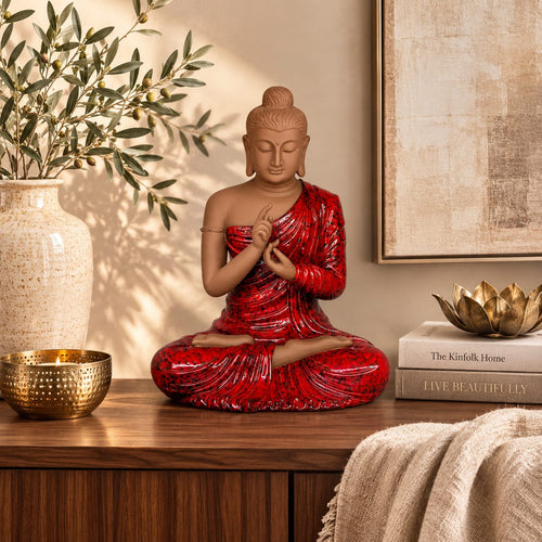Premium handcrafted red Buddha statue displayed on a luxury wooden console with elegant home décor accessories, perfect for living rooms and meditation spaces.