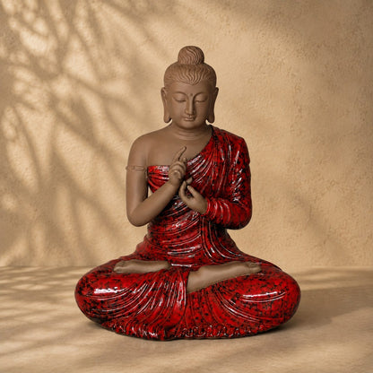 Hand-painted red Buddha statue with a serene matte finish and glossy robe, decorative ceramic sculpture for luxury home décor.