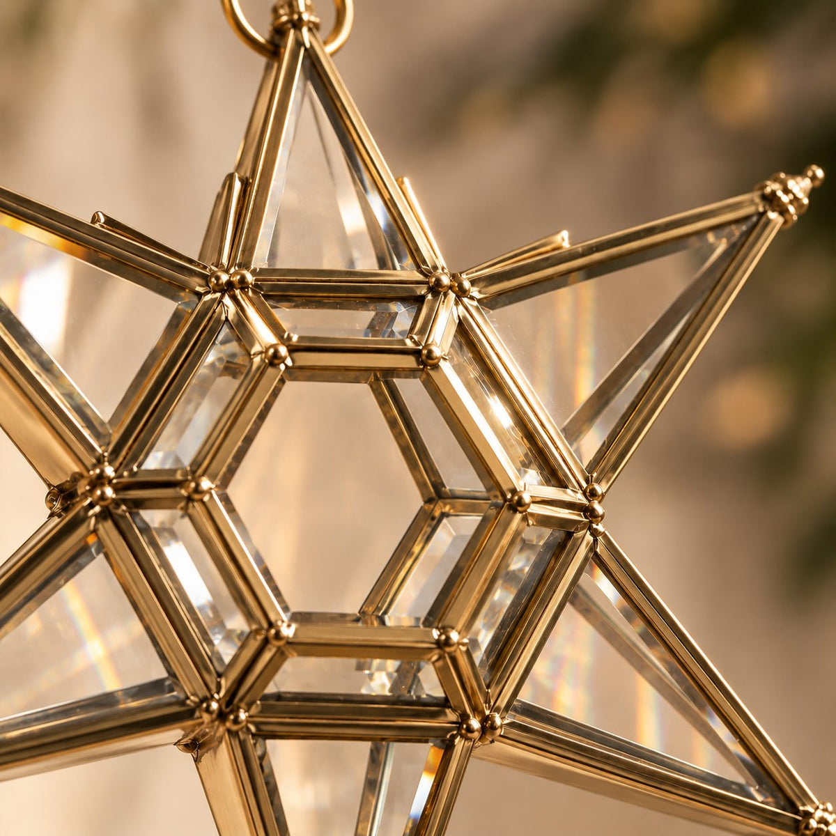 Close-up of handcrafted brass frame and premium stained glass panels on a luxury hanging star lantern.