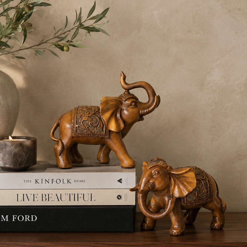 Premium handcrafted elephant sculpture set displayed with designer books, ceramic vase and candle, adding timeless elegance to luxury home décor.