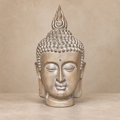 Front view of a premium resin Buddha head sculpture in an elegant champagne finish on a warm beige luxury background.