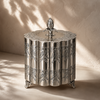 Antique silver keepsake box with embossed floral detailing, shown in use as a premium dry fruit gift box and decorative storage accent.