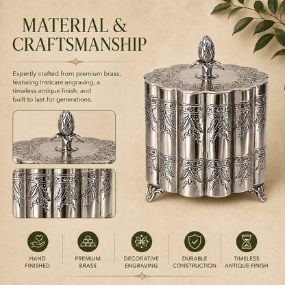 Silver engraved metal storage container showcasing intricate craftsmanship, decorative detailing, premium metal construction, and a timeless antique-inspired finish.