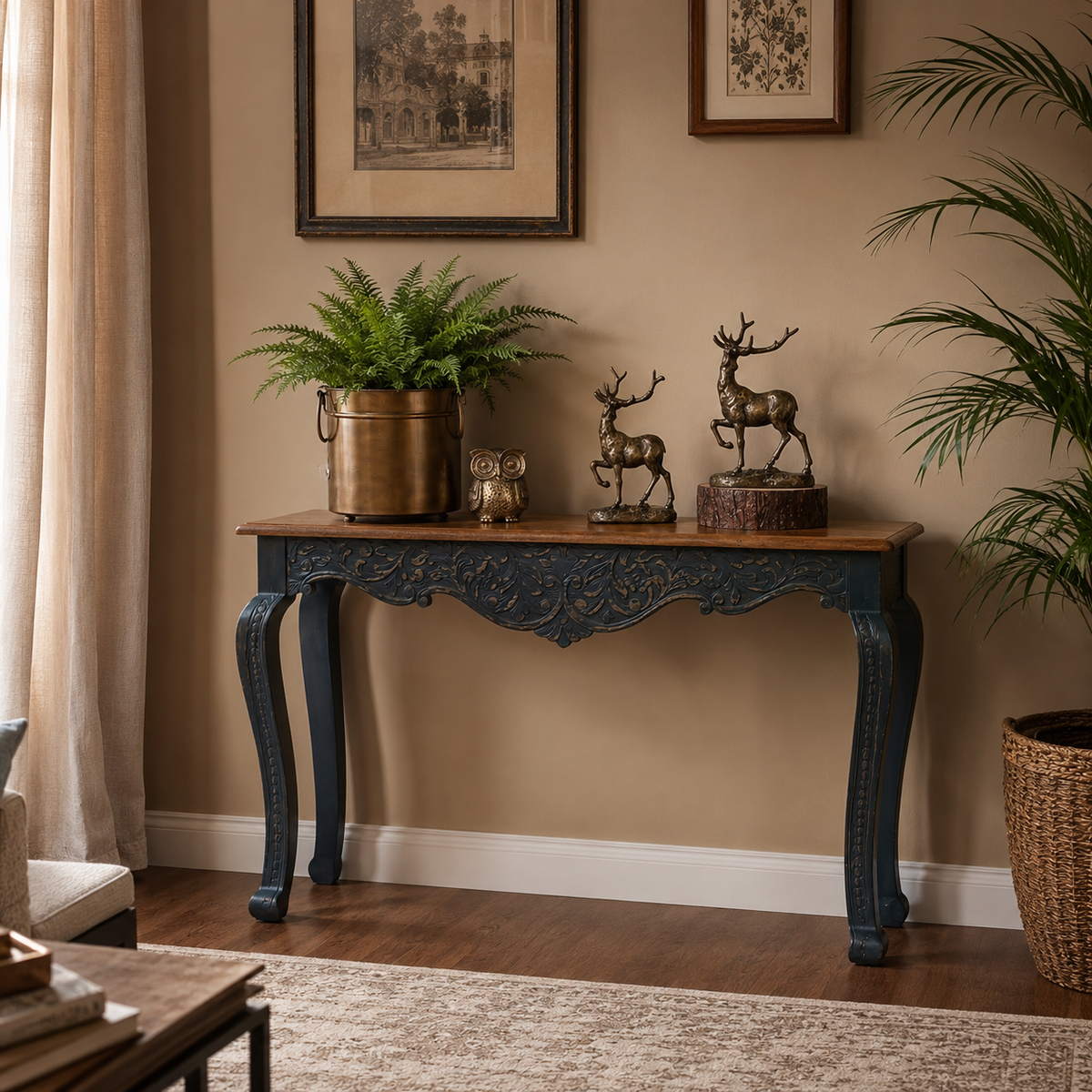 Hand-carved blue wooden console table with intricate floral detailing styled in a luxury living room featuring elegant décor, indoor plants, and a warm neutral interior.