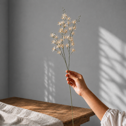 Single realistic artificial white wildflower stem with delicate blossoms and green stem, ideal for DIY floral arrangements, vases, and home décor.
