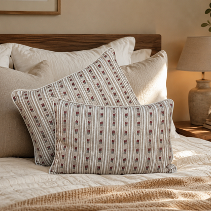 Beige striped linen cushion covers styled on a modern bed with neutral bedding in a cozy luxury bedroom, showcasing elegant decorative cushions for home décor.