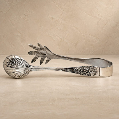 Premium handcrafted silver salad serving tongs with decorative engraved handles in a luxury studio setting by Inara Home Decor.