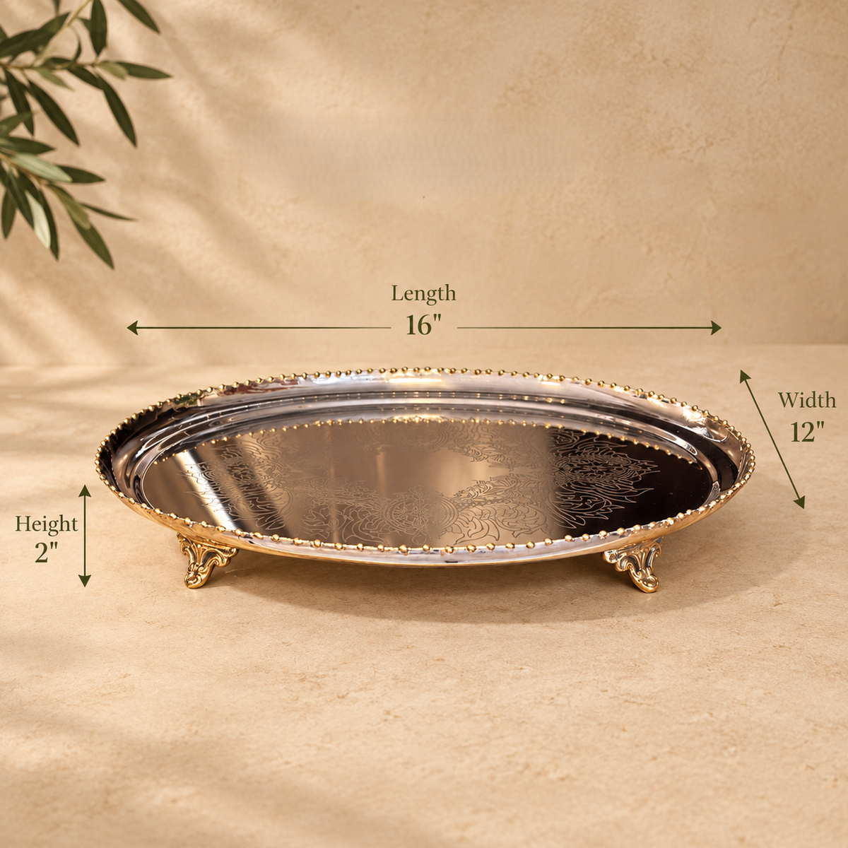 Dimensions of the silver decorative serving tray measuring 16 inches long, 12 inches wide and 2 inches high.