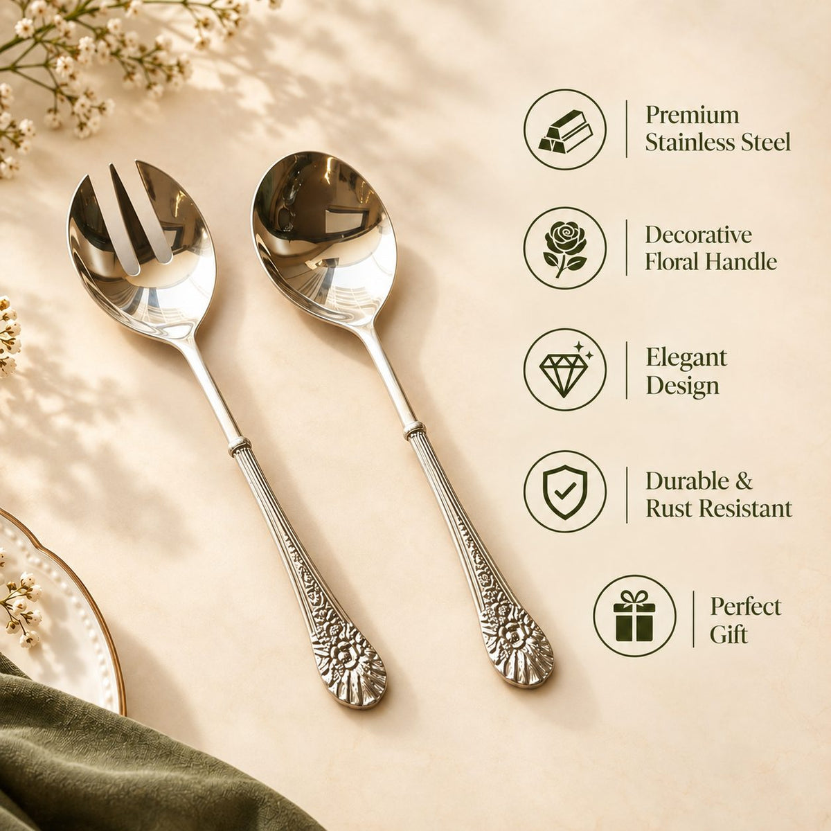 Premium stainless steel serving spoon and fork set with elegant floral engraved handles, featuring durable rust-resistant construction, decorative design, and gift-worthy craftsmanship on a warm beige background by Inara Home Decor.