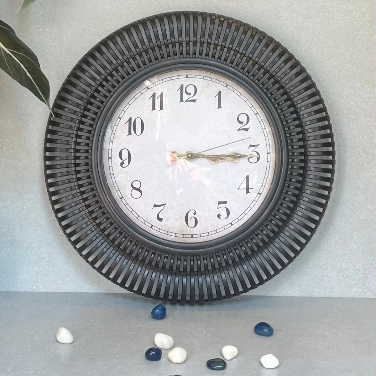 Sunburst Clock Black – A stylized wall clock adds a touch of whimsy to your decor.Undeniably nostalgic and definitely charming | INARA