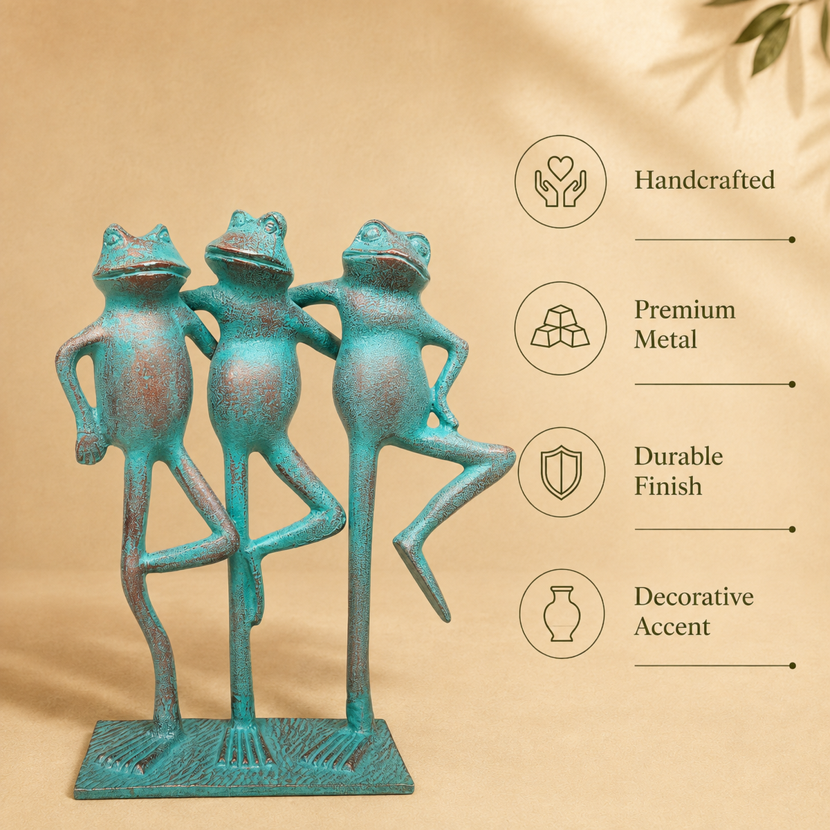 Handcrafted metal frog trio sculpture with turquoise patina finish featuring premium metal construction, durable finish, and decorative accent details.