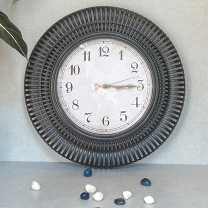 Sunburst Clock Black – A stylized wall clock adds a touch of whimsy to your decor.Undeniably nostalgic and definitely charming | INARA